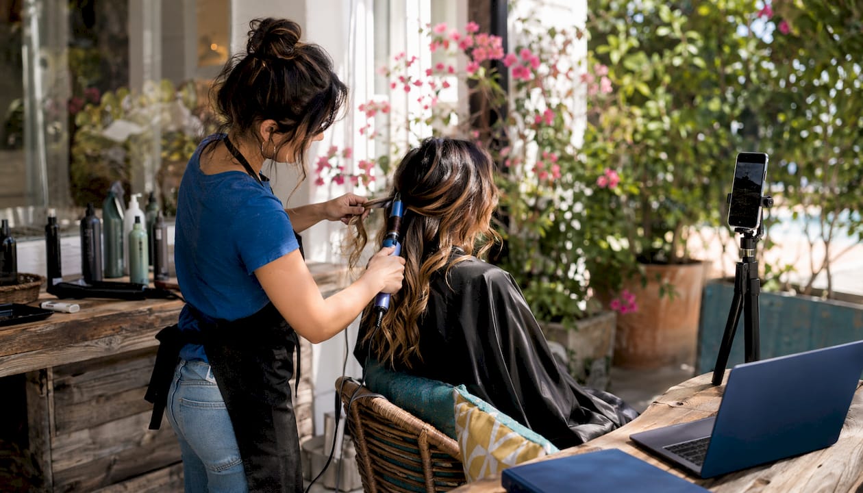 Stylist filming hair transformation video