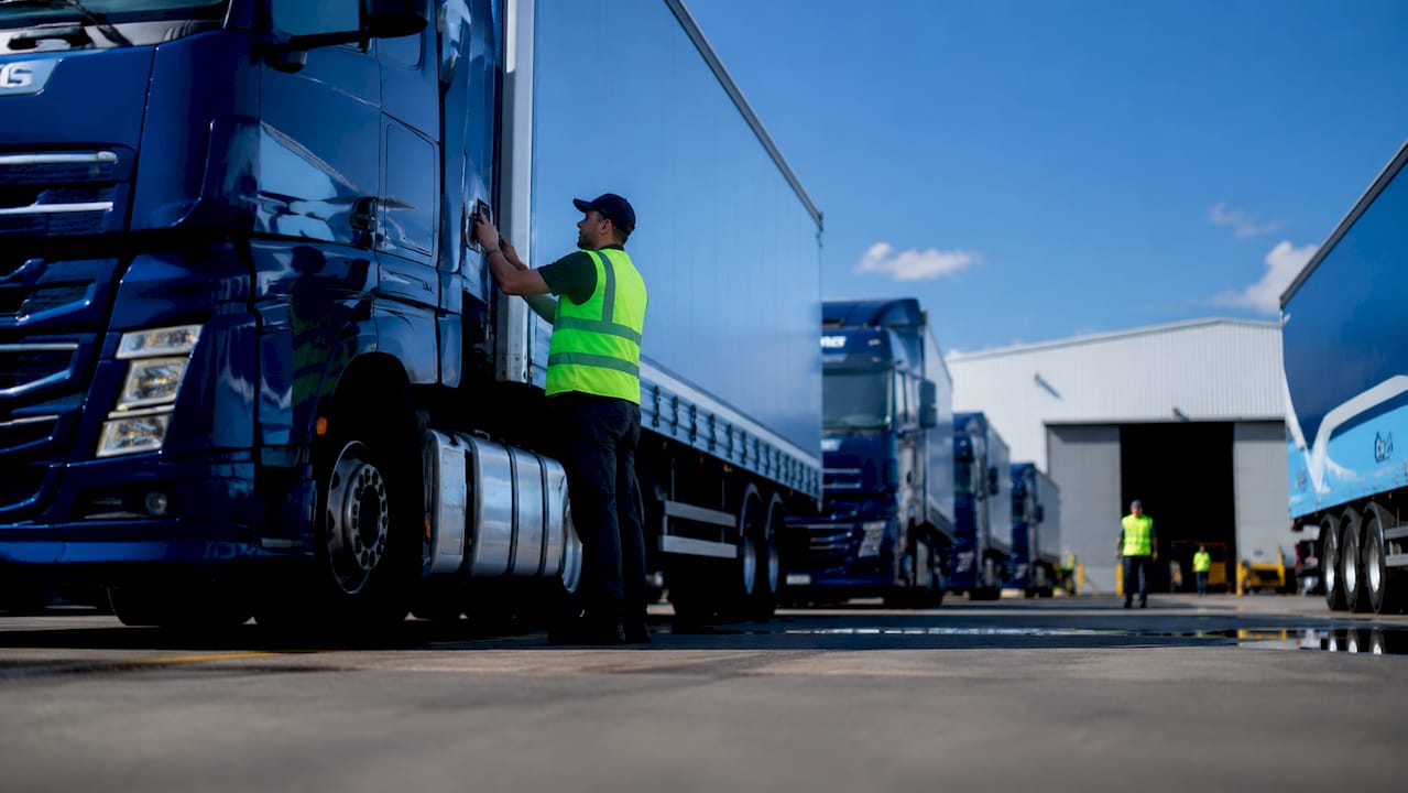 Fleet of trucks at supply chain depot