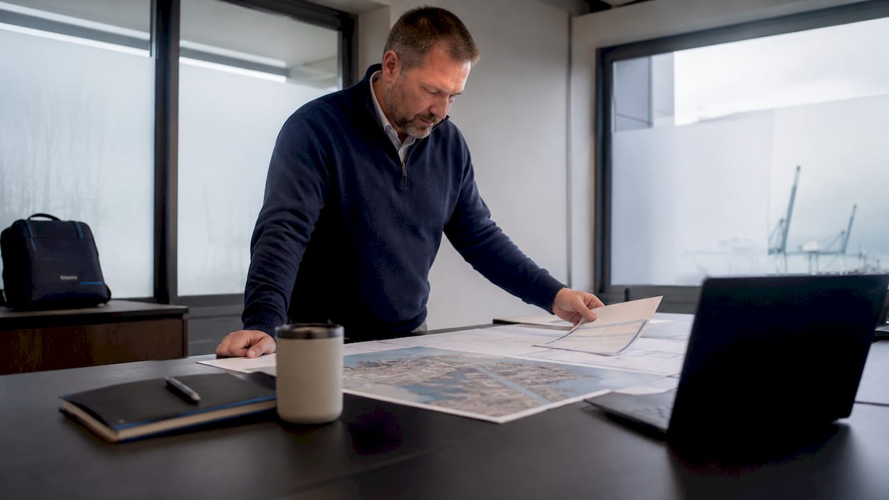 Logistics coordinator reviewing Felixstowe port documents