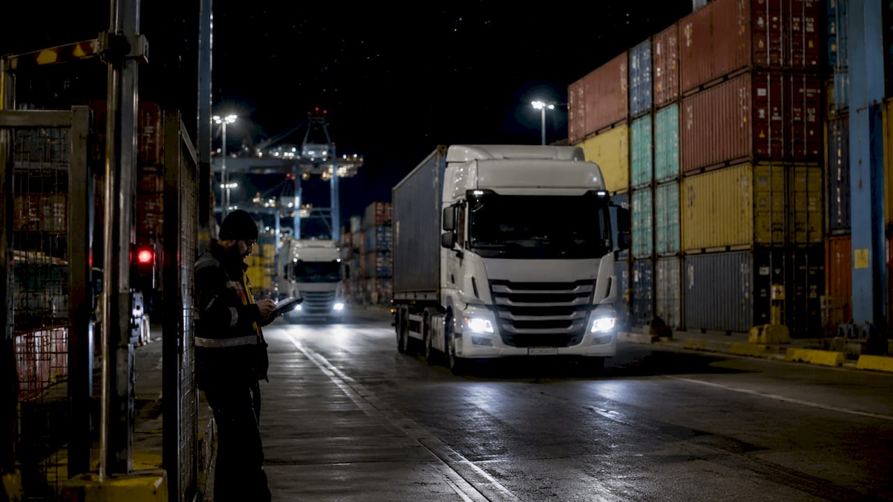 Felixstowe Trinity terminal at dusk with trucks waiting