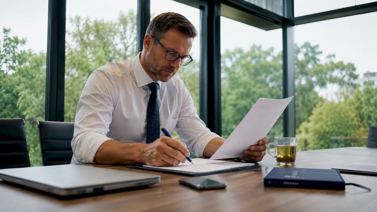 Manager reviewing haulage SLA document at desk