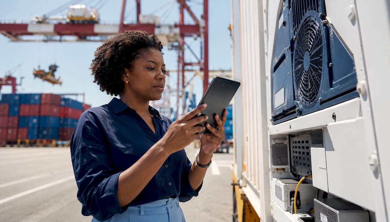 Logistics manager inspecting refrigerated container
