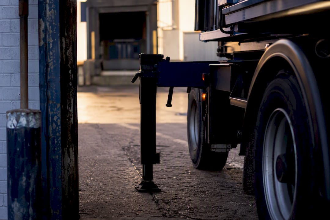 Container truck navigating narrow warehouse gate