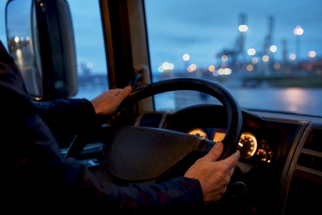 UK HGV driver checking cab controls
