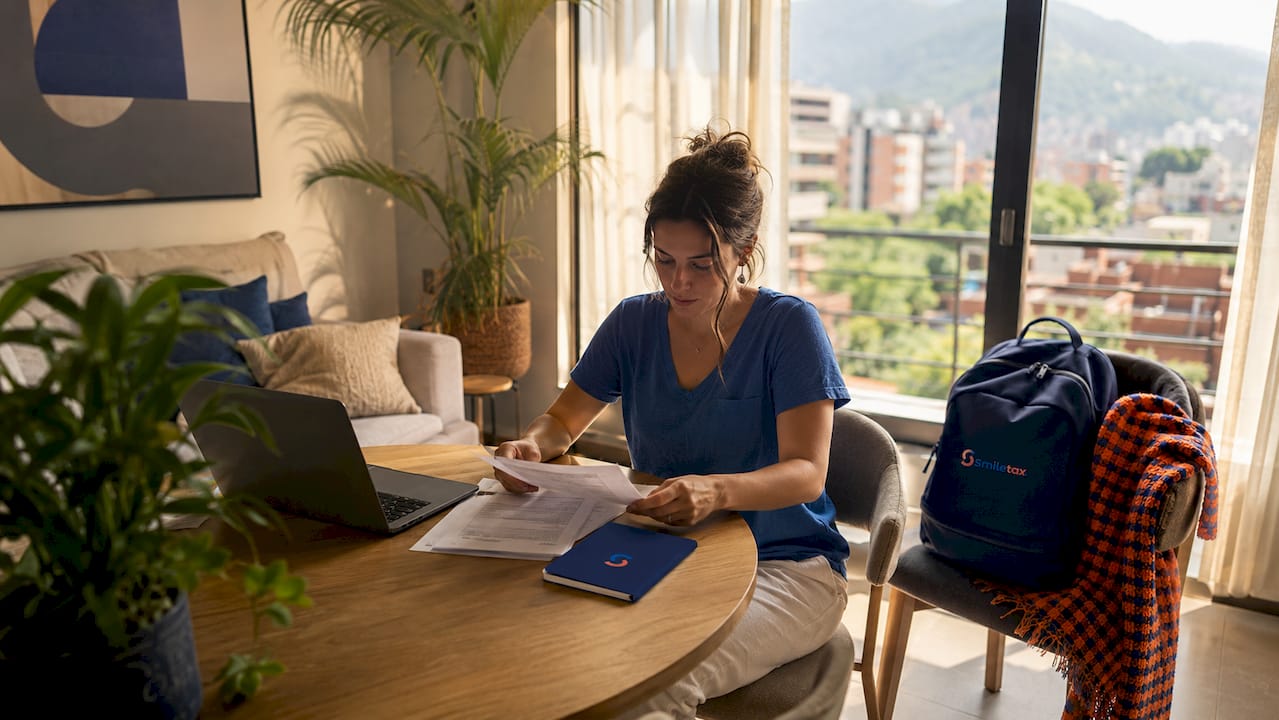 Furnished Medellín apartment with woman arranging papers