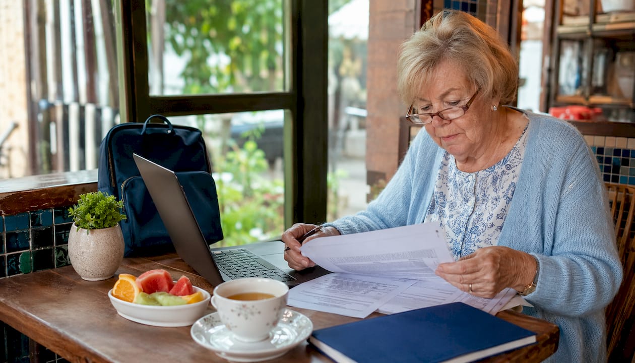 American retiree examining visa paperwork