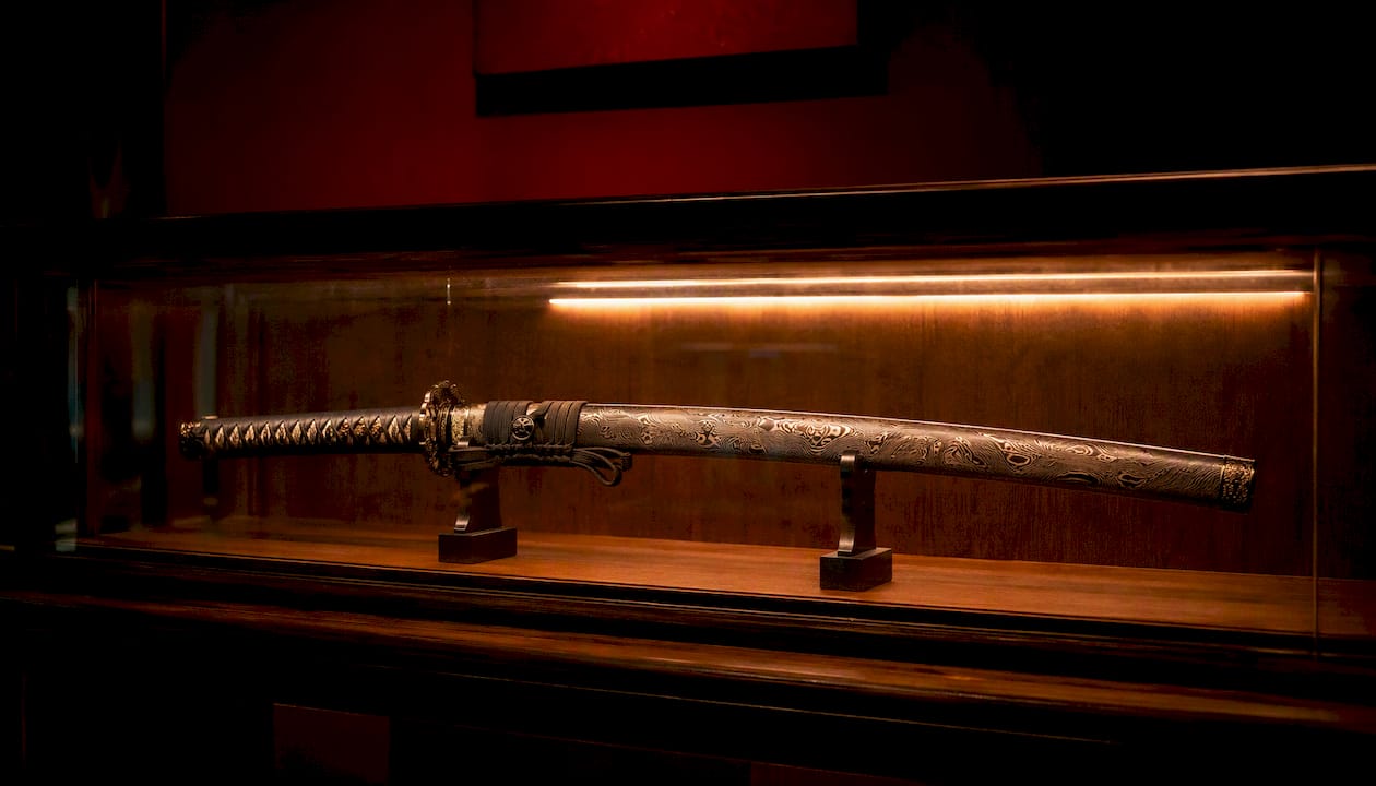 Katana in lit glass display case