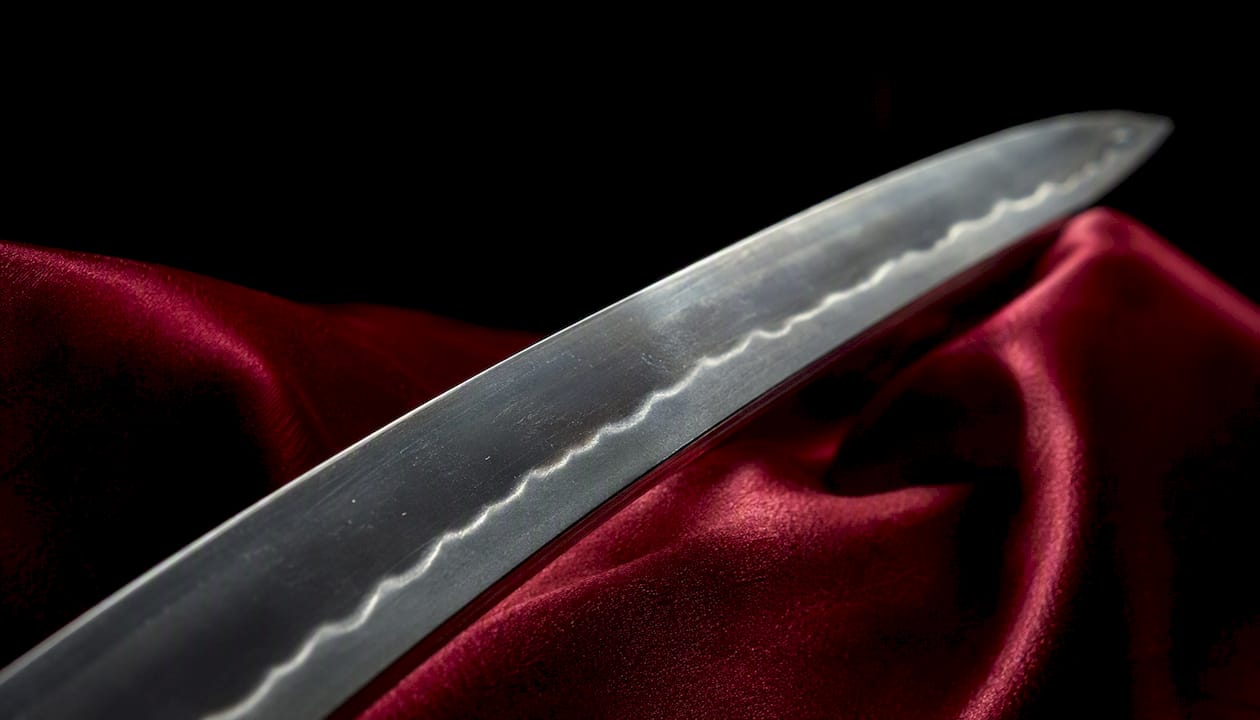 Macro of straight suguha hamon line on katana