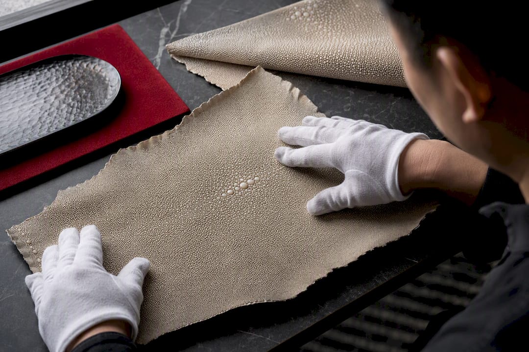 Craftsperson inspecting samegawa nodules and thickness