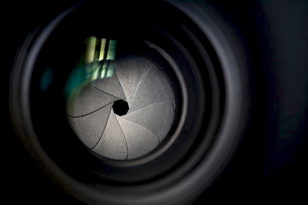 Close-up of camera lens aperture blades at medium aperture