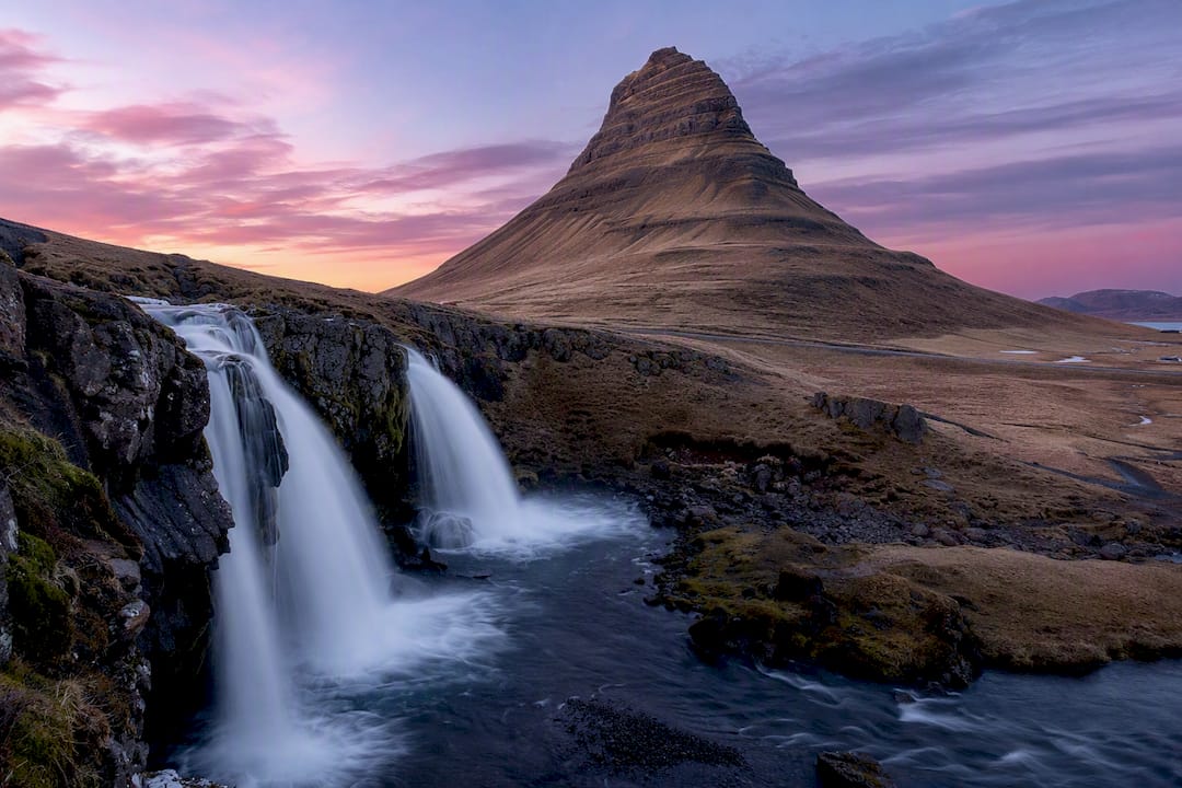 Kirkjufell mountain and waterfall at twilight