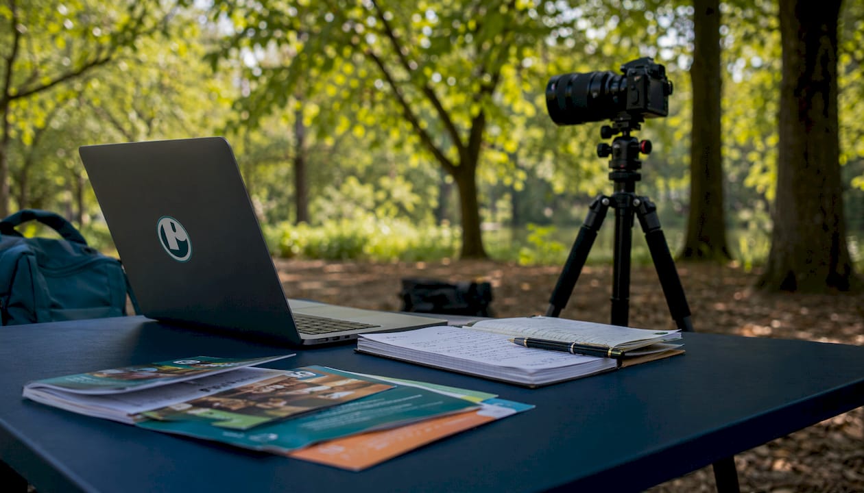 Advocacy video editing workspace with equipment and materials