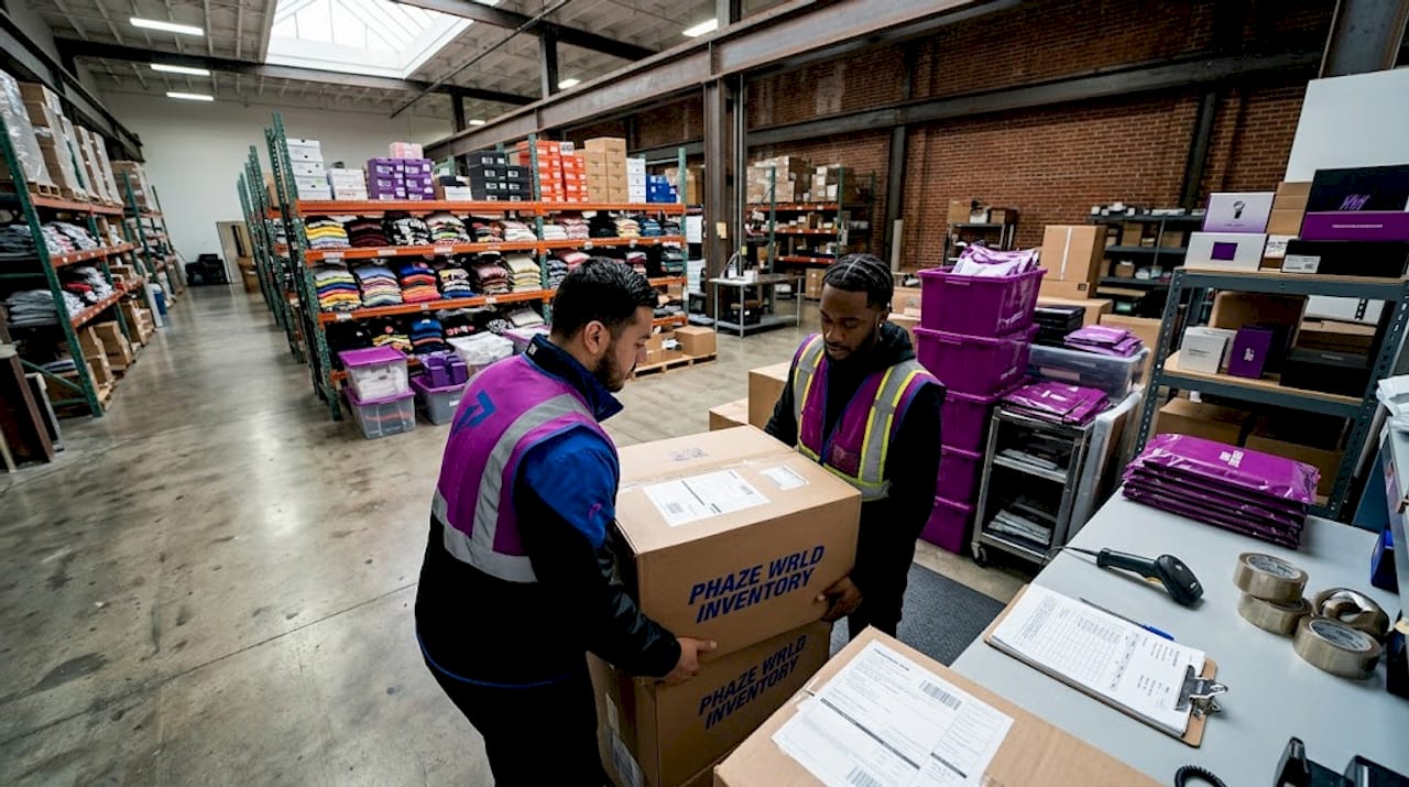 Warehouse staff processing clothing shipment arrivals