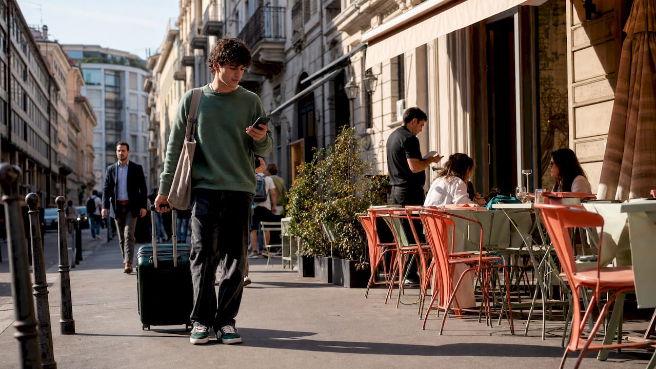 Student commuting at Milan tram platform