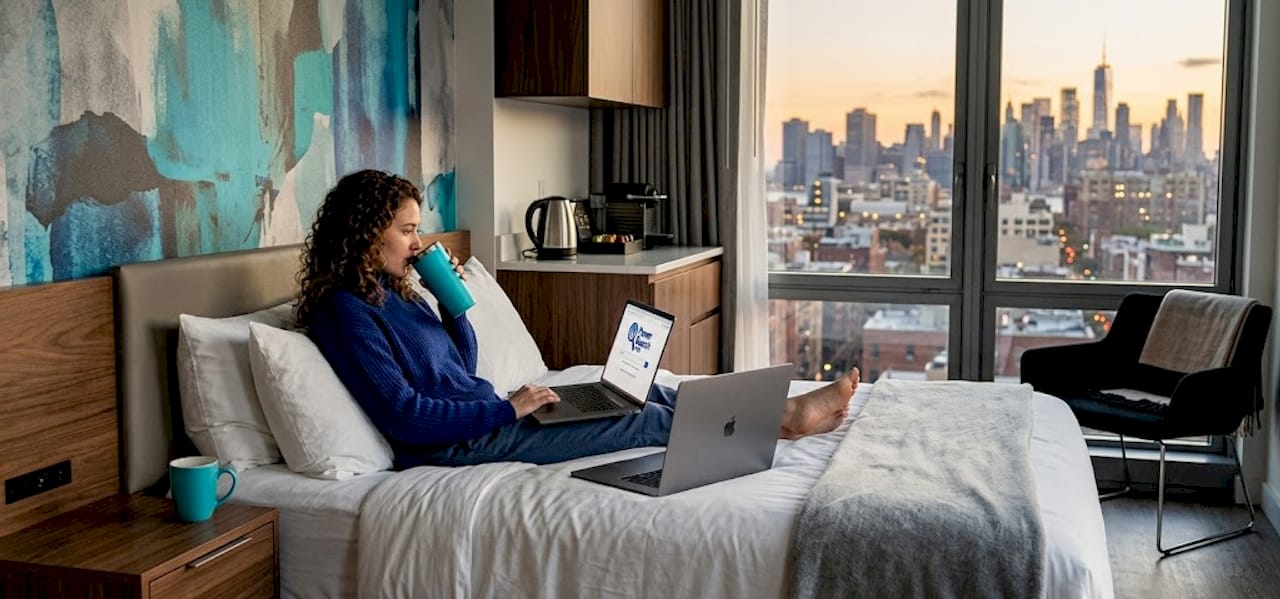 Person relaxing in modern NYC hotel room