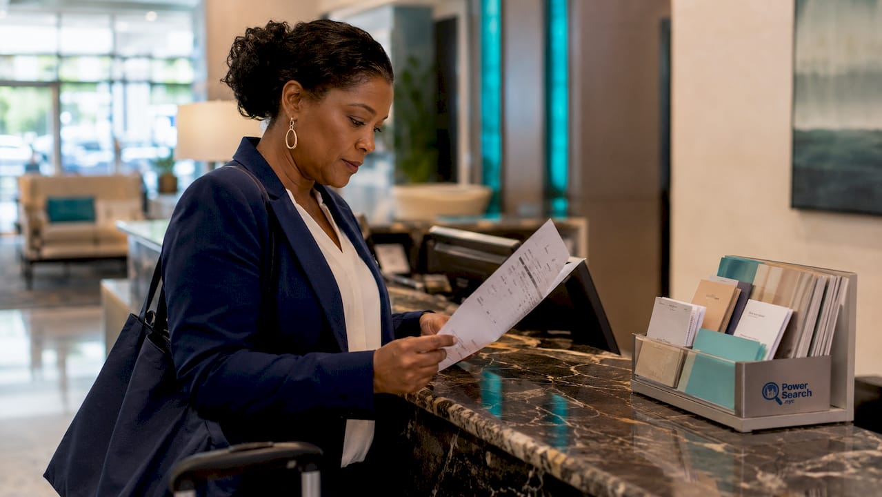 Hands pointing at NYC hotel guest folio charges