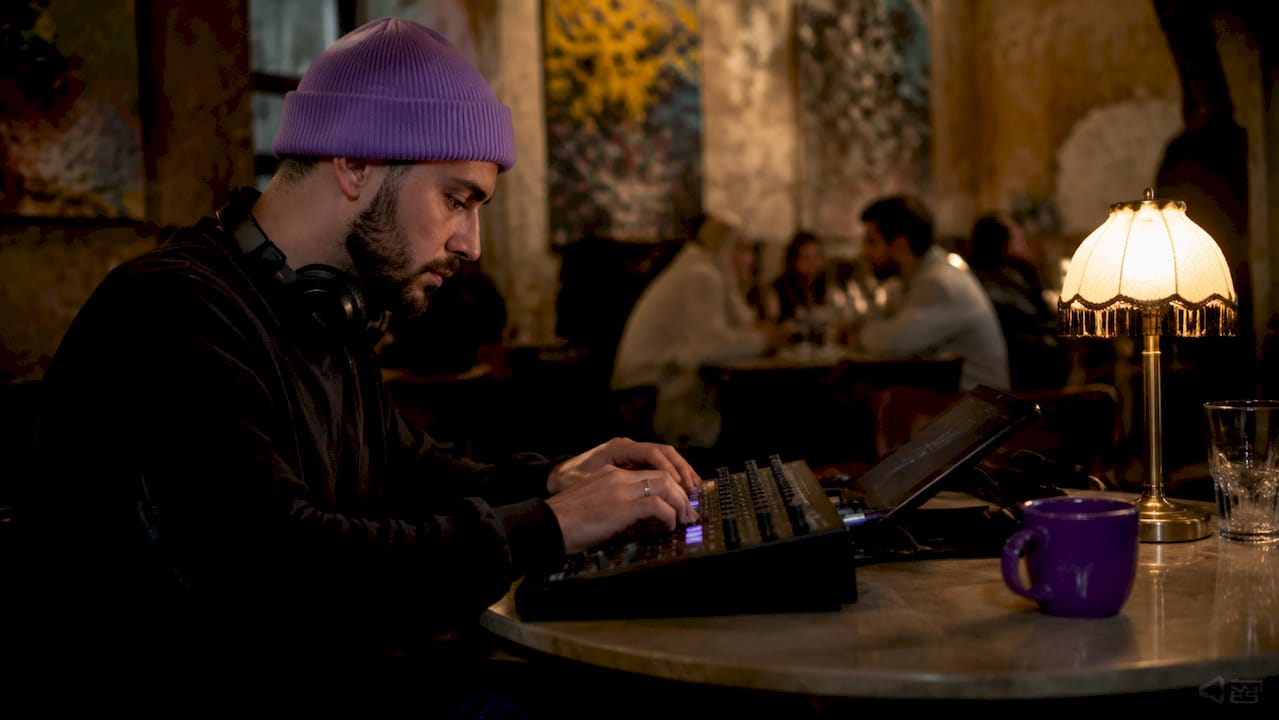 Audio engineer working on mixing console