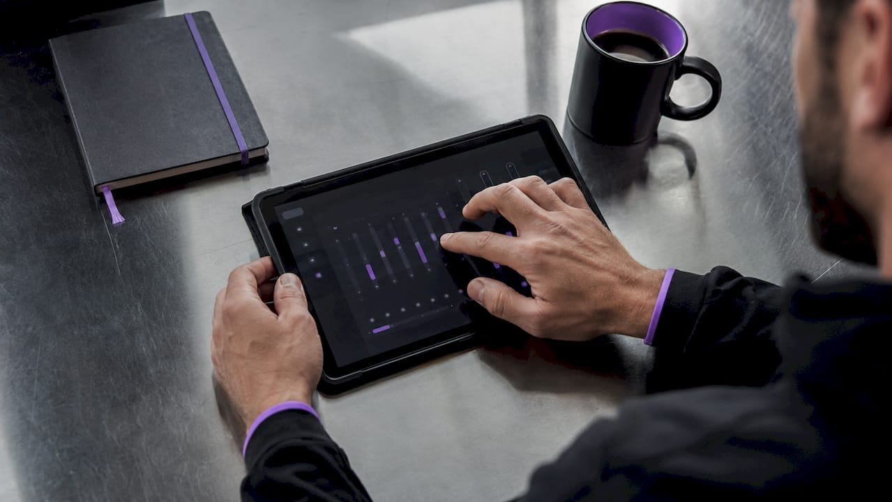 Close-up of hands adjusting MIDI plugin controls