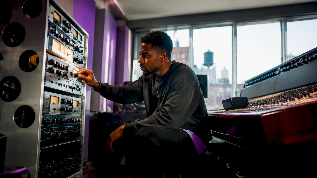 Sound engineer adjusting preamp in studio