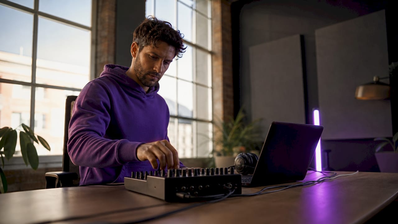 Engineer configuring low-latency audio interface setup