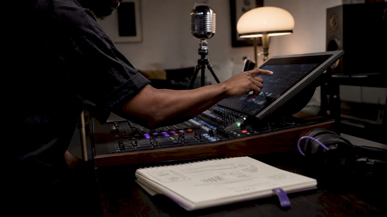 Hands adjusting DAW plugin settings