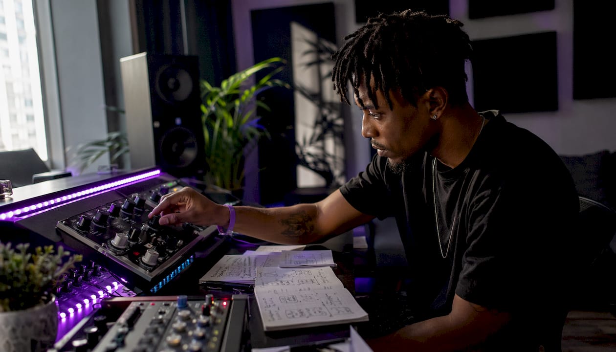 Producer adjusting analog audio compressor controls