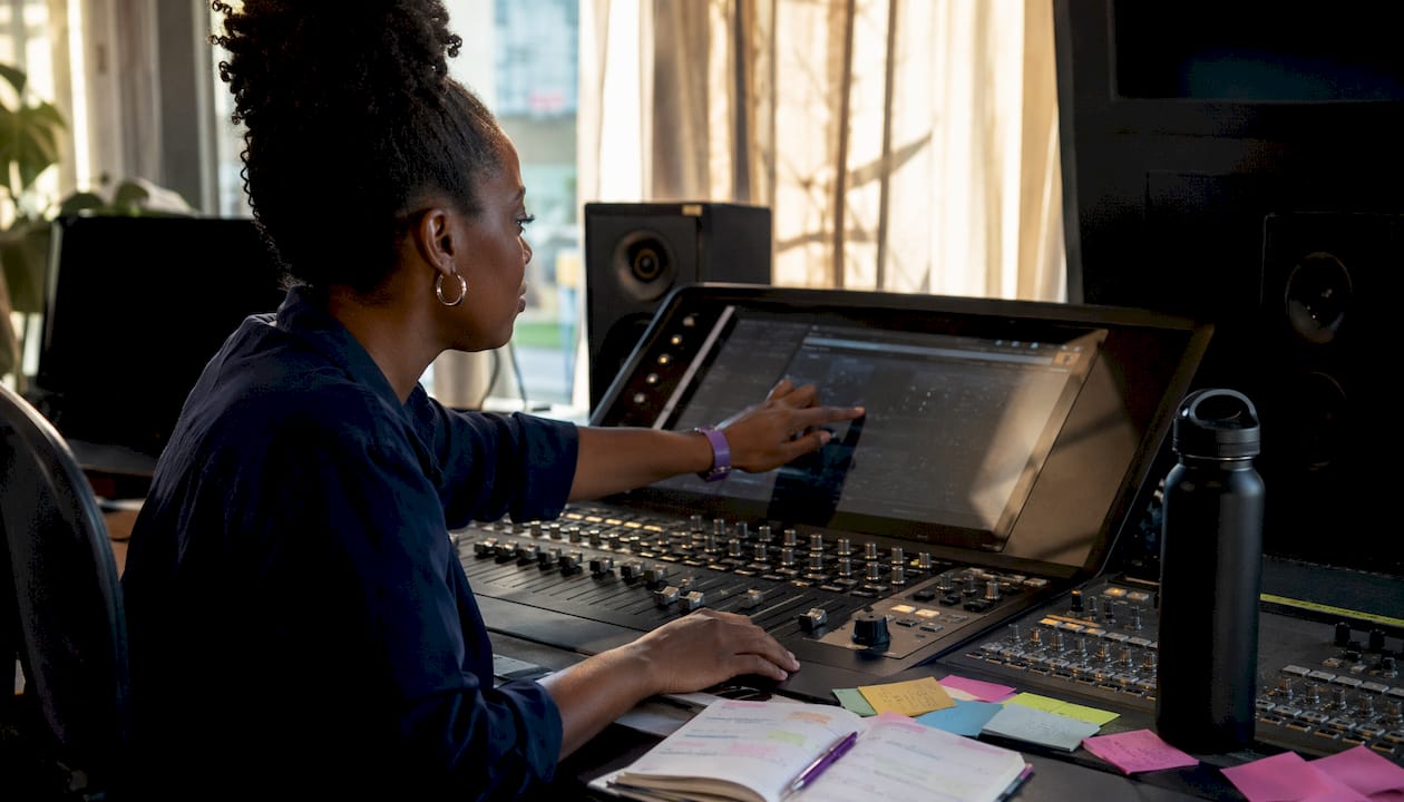 Engineer selecting sample rate on mixing desk