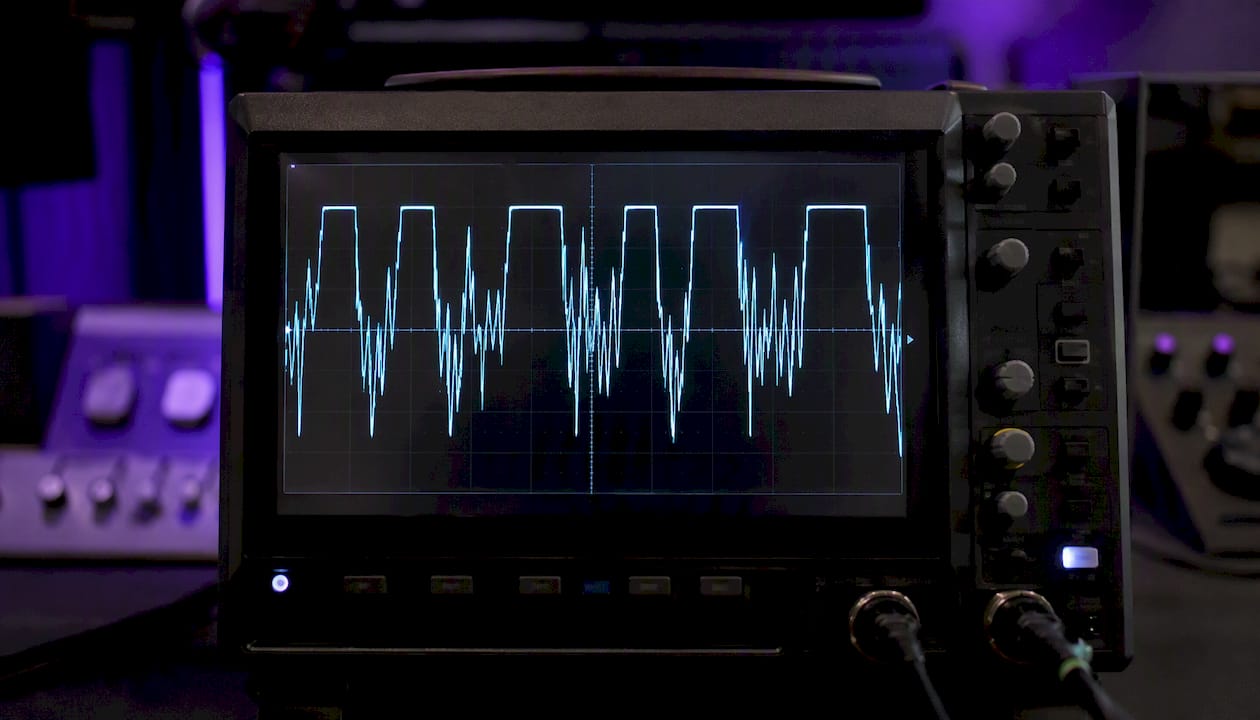 Oscilloscope showing clipped audio waveform