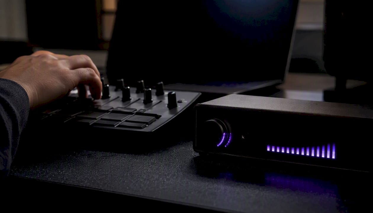 Hands near MIDI controller and CPU load meter