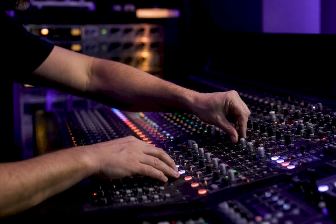Hands setting up parallel audio effect chains