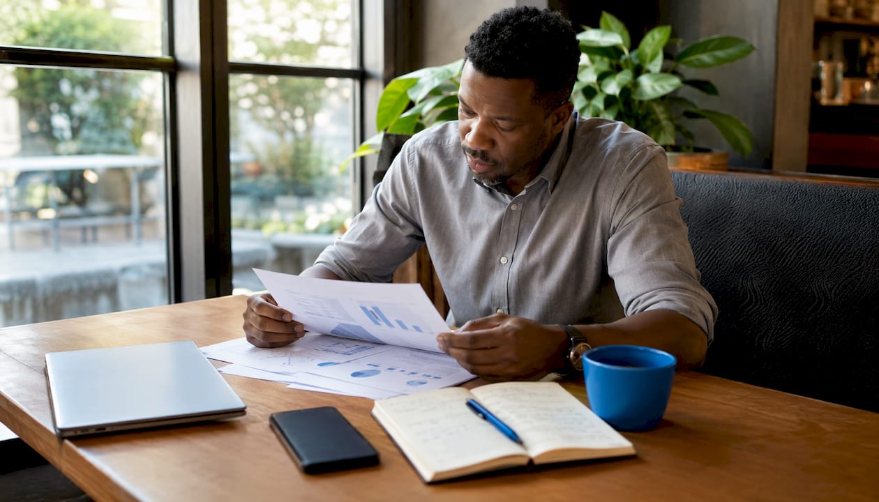 Professional analyzing mobile SEO report at desk