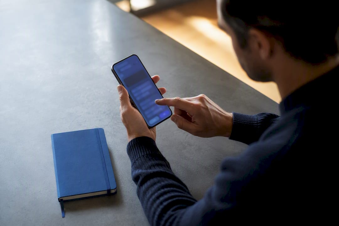 Hand completing an accountability app check-in
