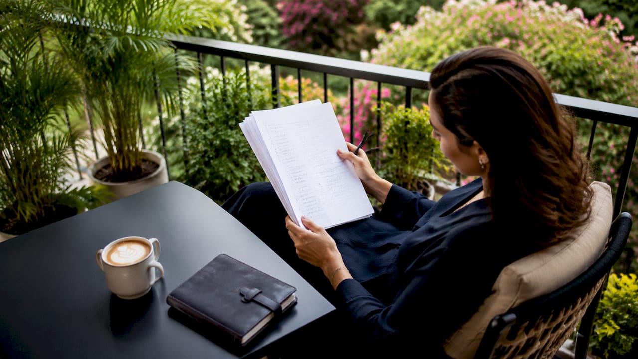 Planner reviewing wedding setup checklist at café