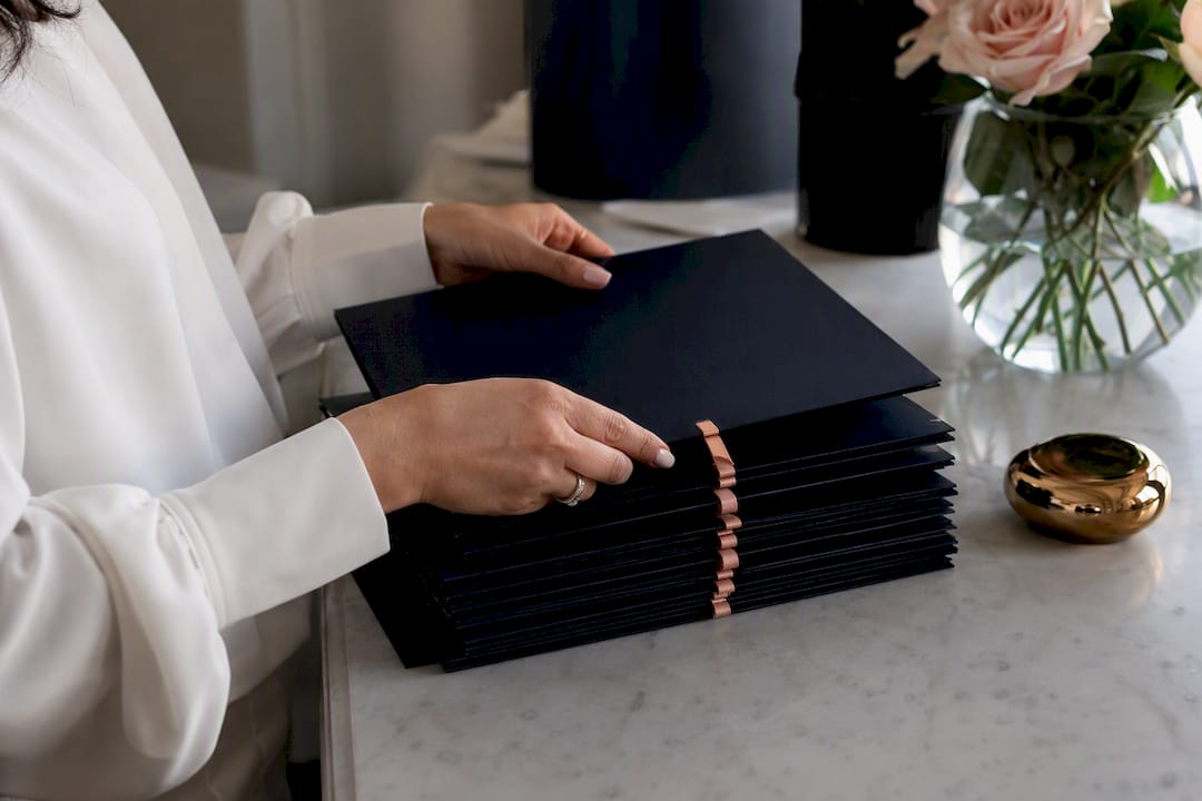 Hands organizing client trust account folders