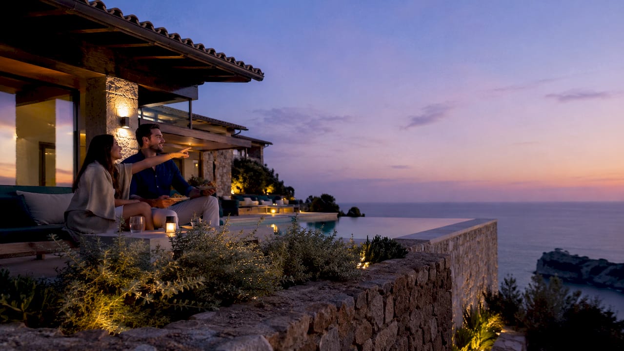 Couple enjoying sea view from Mallorca villa terrace