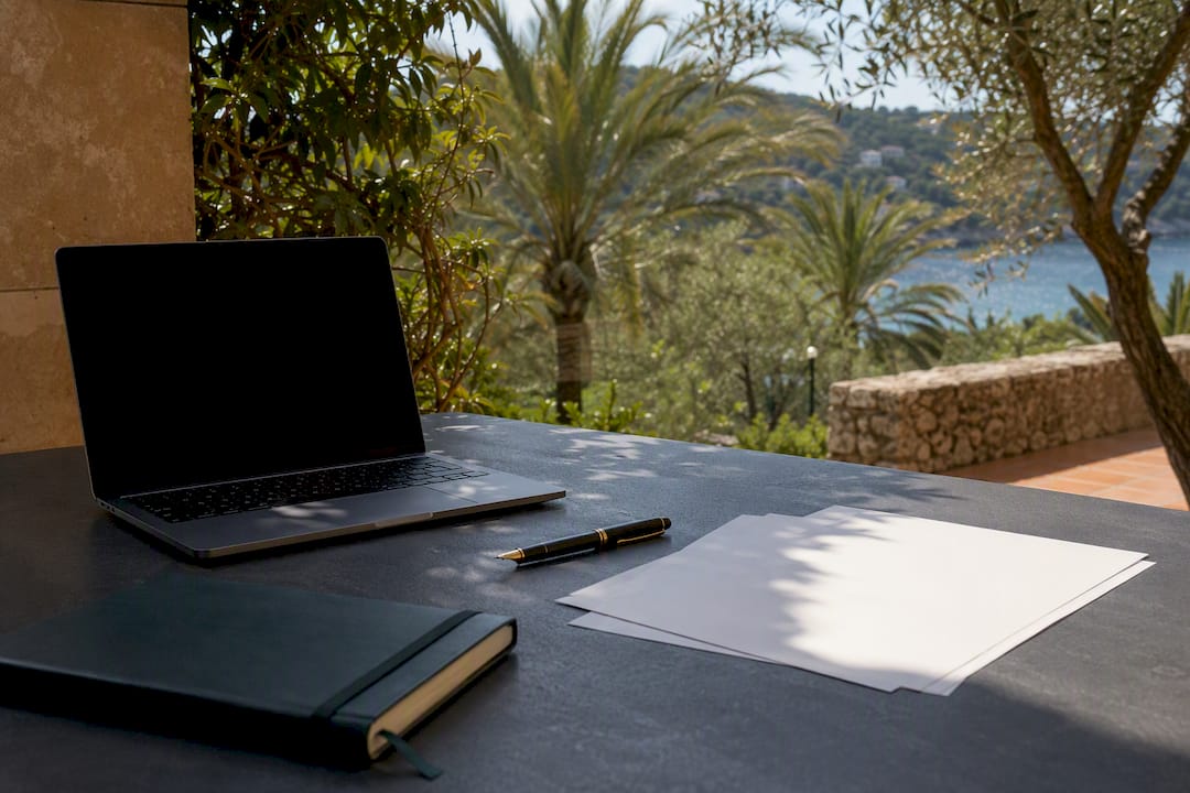 Villa terrace table with tax documents and pen