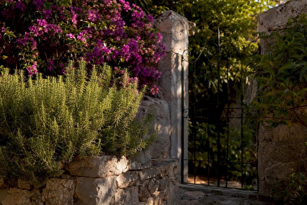 Secluded Deià villa garden stone wall and gate