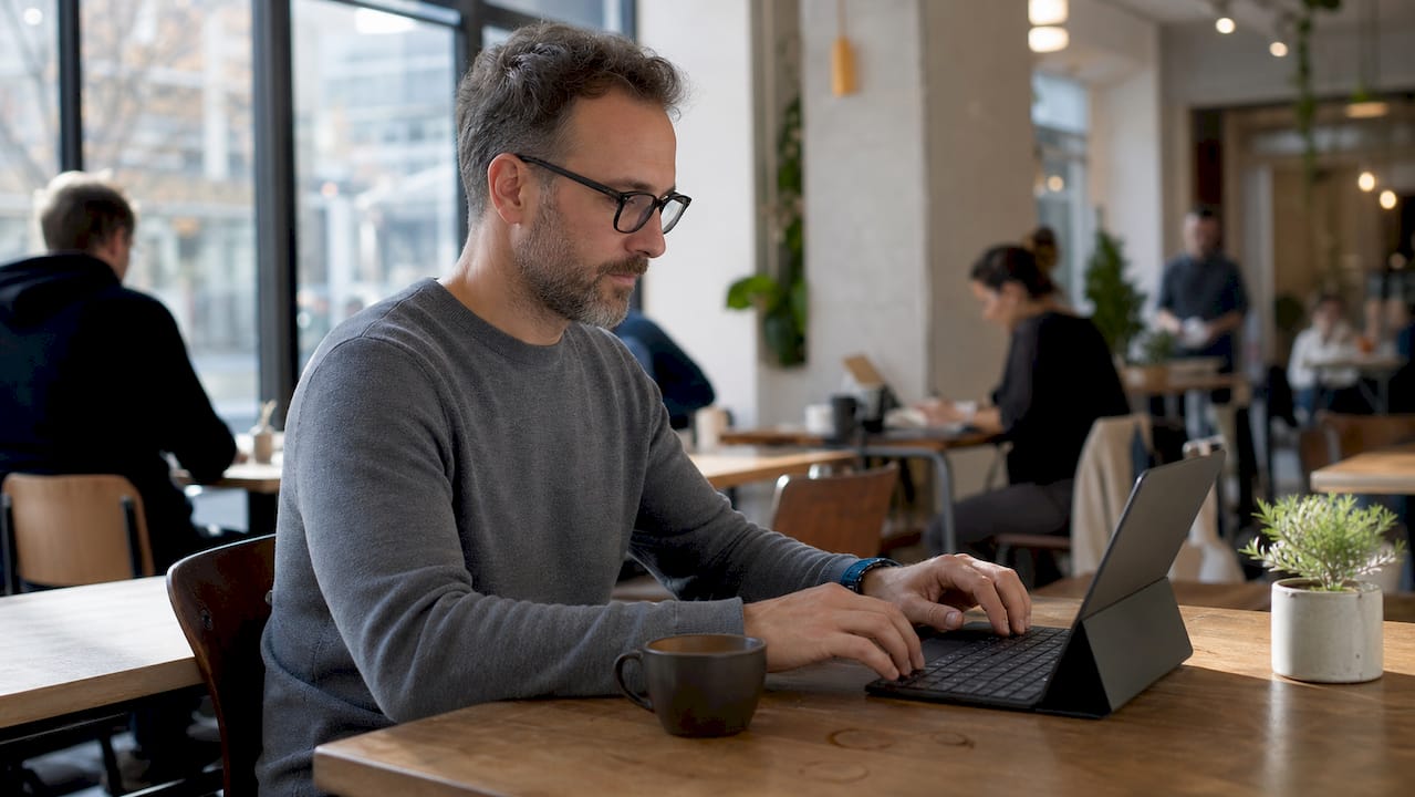 Hands typing on keyboard by transcription manual
