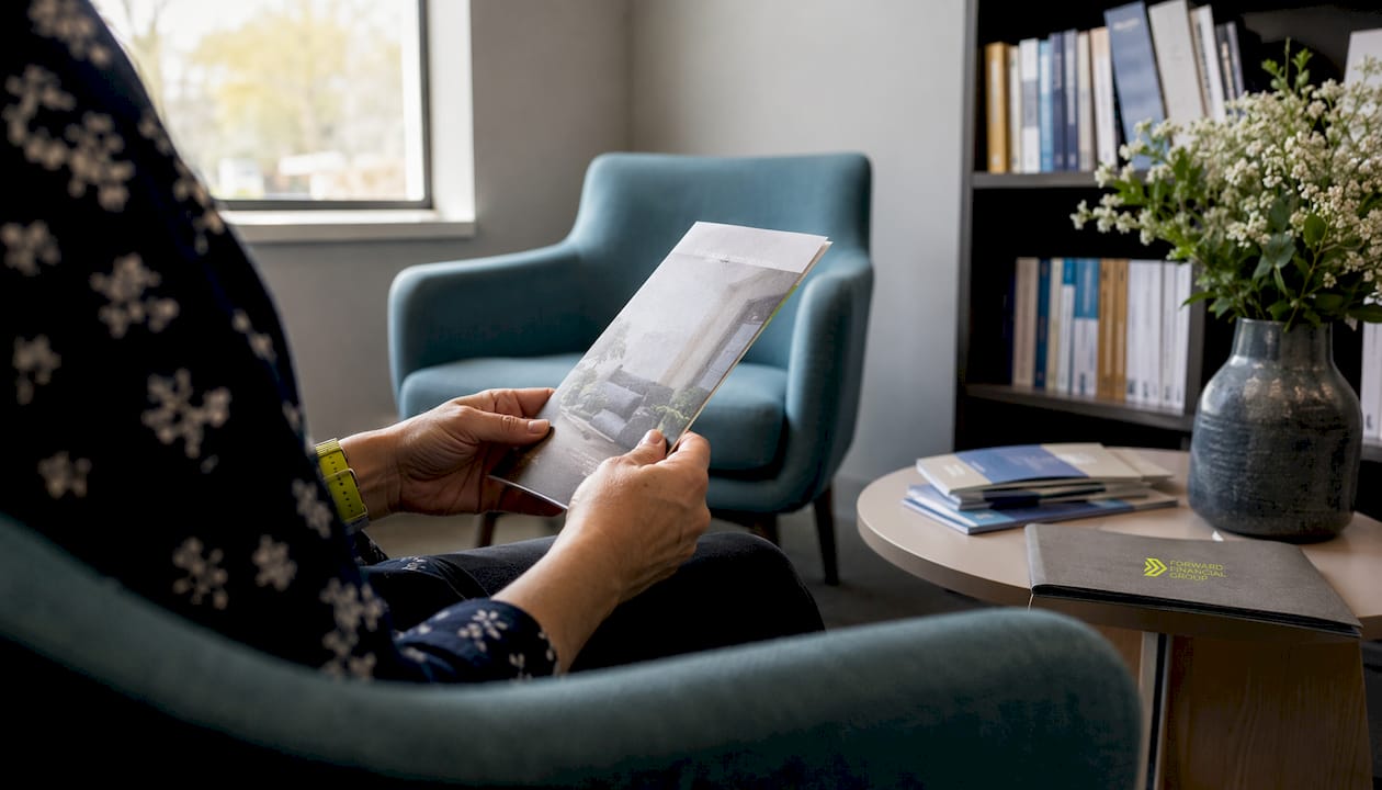 Hands holding counseling pamphlet in waiting area