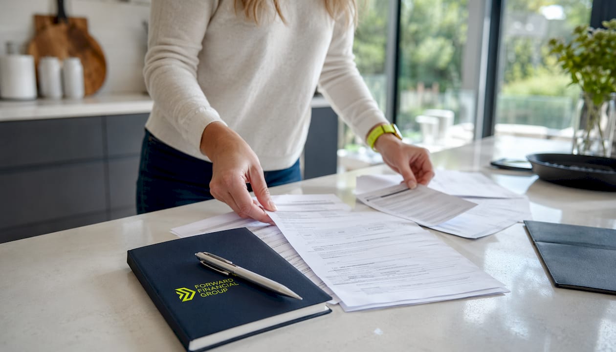 Hands preparing fast approval loan documents overhead view