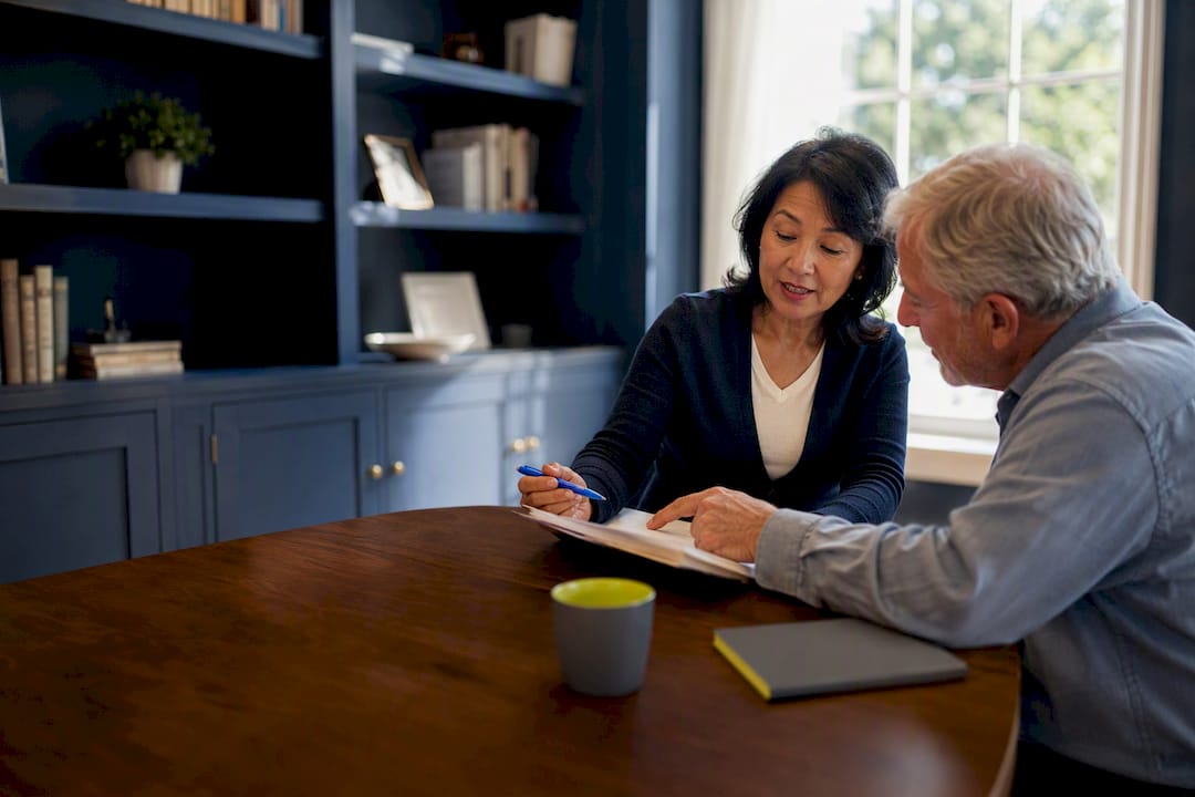 Senior reviewing reverse mortgage counseling guidance