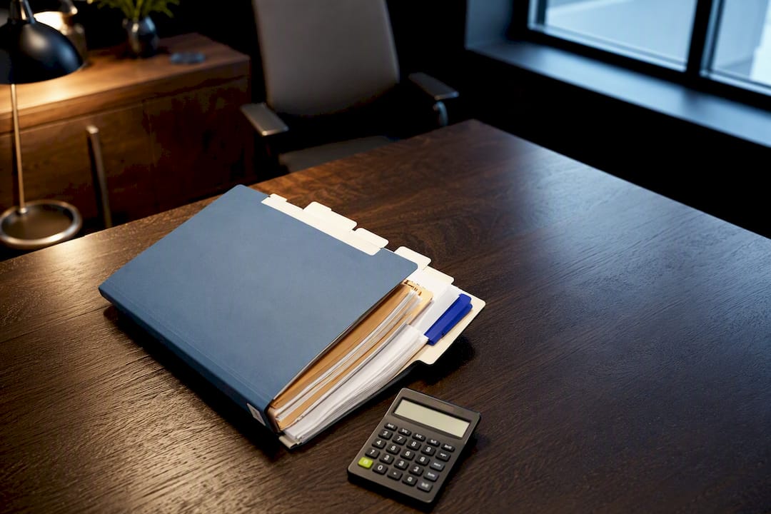 Organized mortgage underwriting file on review table