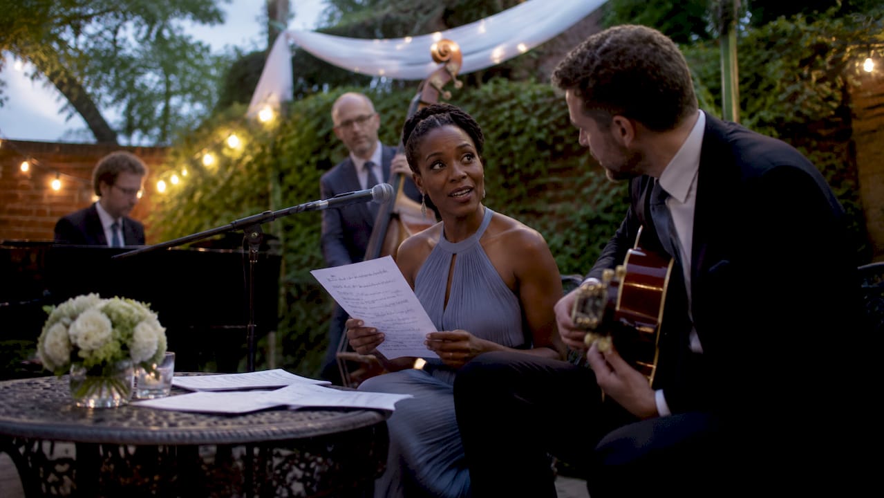 Live wedding band coordinating requests on stage