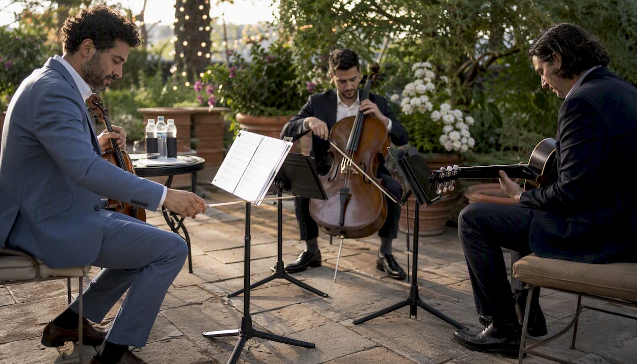 Musicians preparing instruments backstage at private event