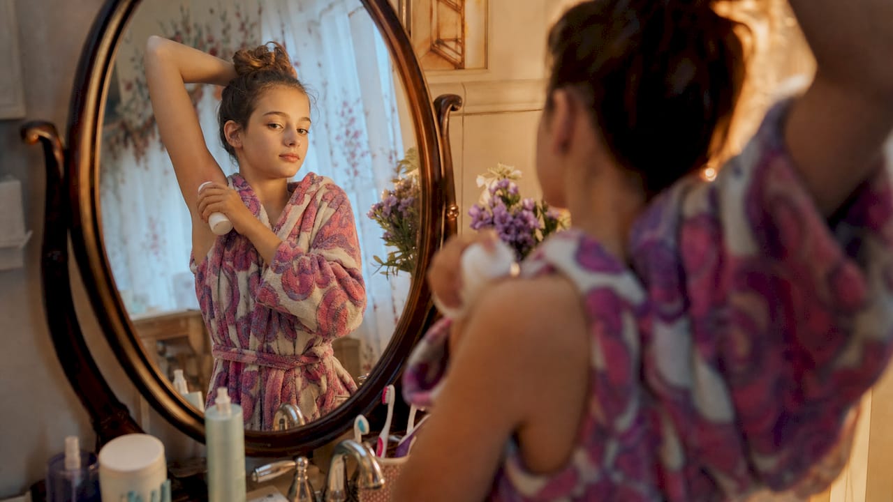 Teen girl practicing personal hygiene