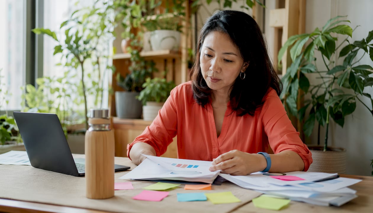 Data scientist reviewing AI strategy reports in office