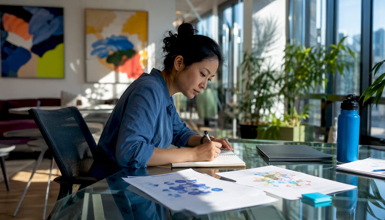 Developer taking notes on AI tracing workflow