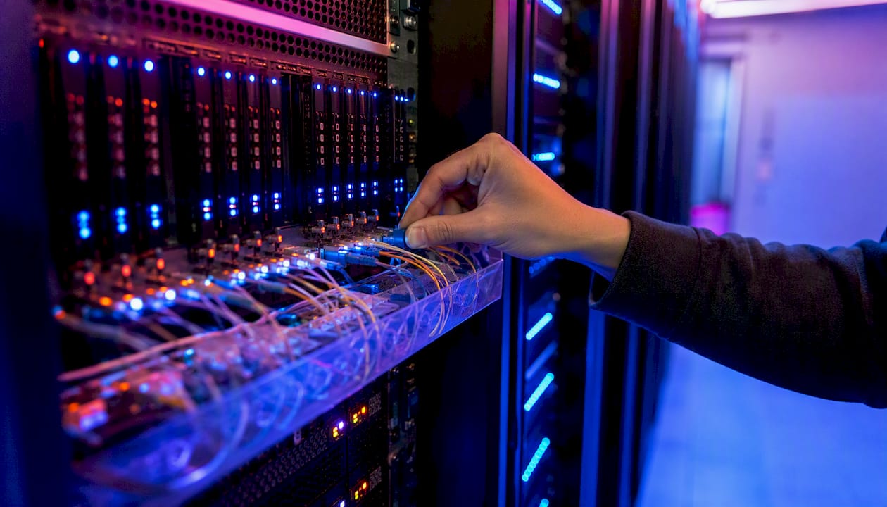 Hand handling fiber connector in server room