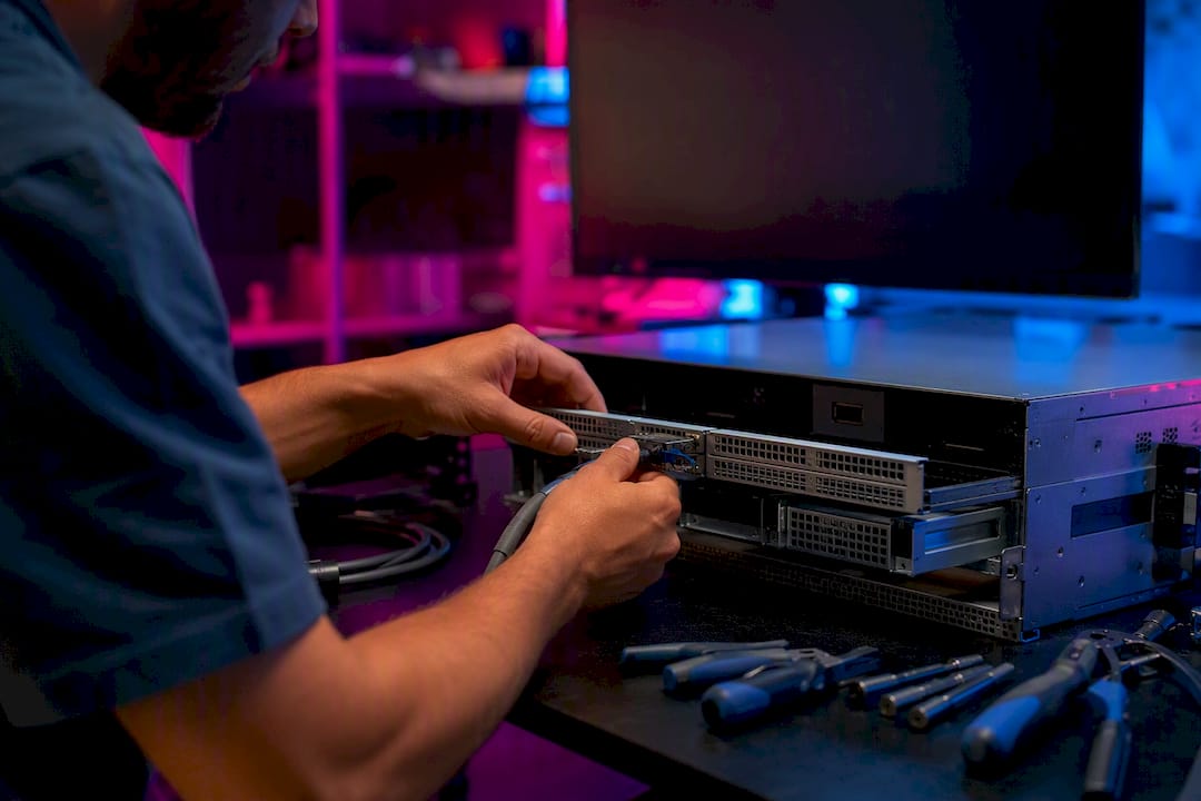 Hands connecting hardware for AI pipeline
