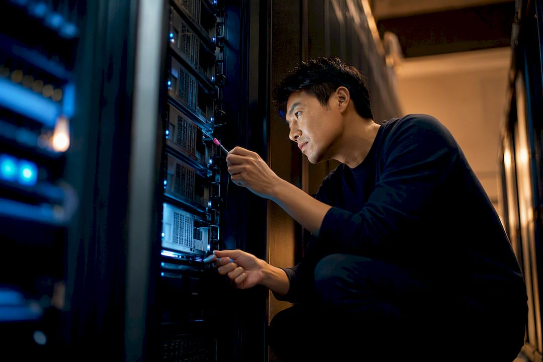 Engineer inspecting agent server infrastructure